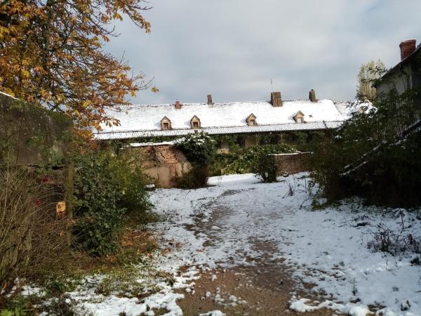 Maison sous la neige